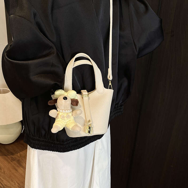 Fashionable Western vegetable basket water bucket for women 2025 solid color lychee pattern niche single shoulder crossbody bag new style temperament 