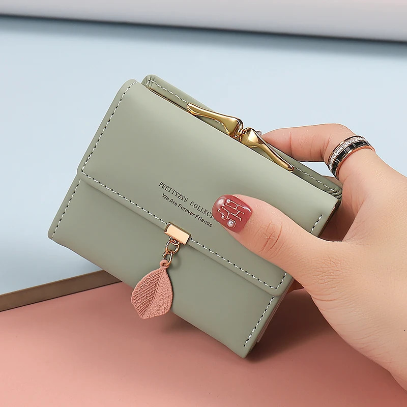 summer Explosion-style womens short wallet Korean PU leather simple everything with solid color personality leaf pendant b 250514