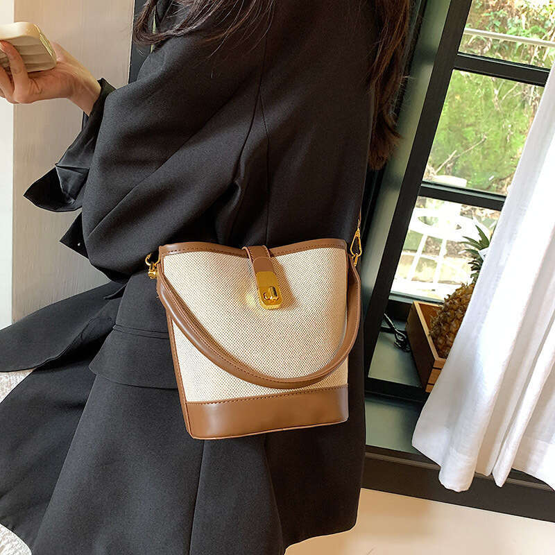 Niche retro for women 2025 high-end versatile, portable bucket spliced single shoulder crossbody bag, women's handbag new style, unique and elega
