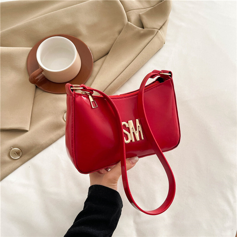 Western Women's 2025 Luxury Bag Summer New Style Texture Popular Letter Commuting Handheld New Free Delivery Designer Bag Crossbody Bag Trend