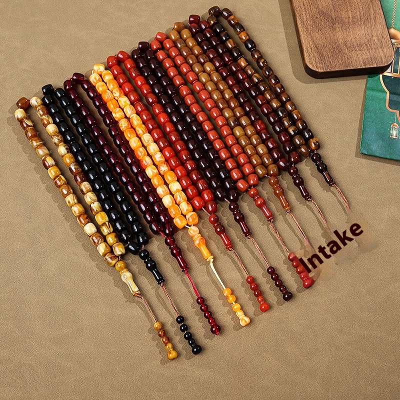 Cylindrical Buddhist with Cook holding 33 praise beads, Muslim prayer bead bracelet