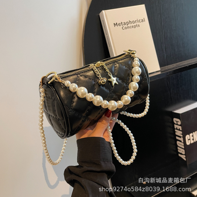 New summer single shoulder womens new pearl chain handbag simple and fashionable designer crossbody bag trendy cylindrical bag niche popular handbag c