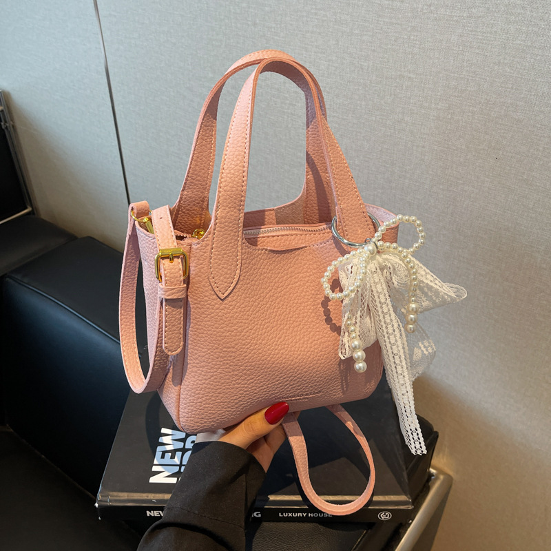 New high-end women's simple handbag for spring and summer with lychee pattern bow and ribbon designer single shoulder crossbody bag commuting sol