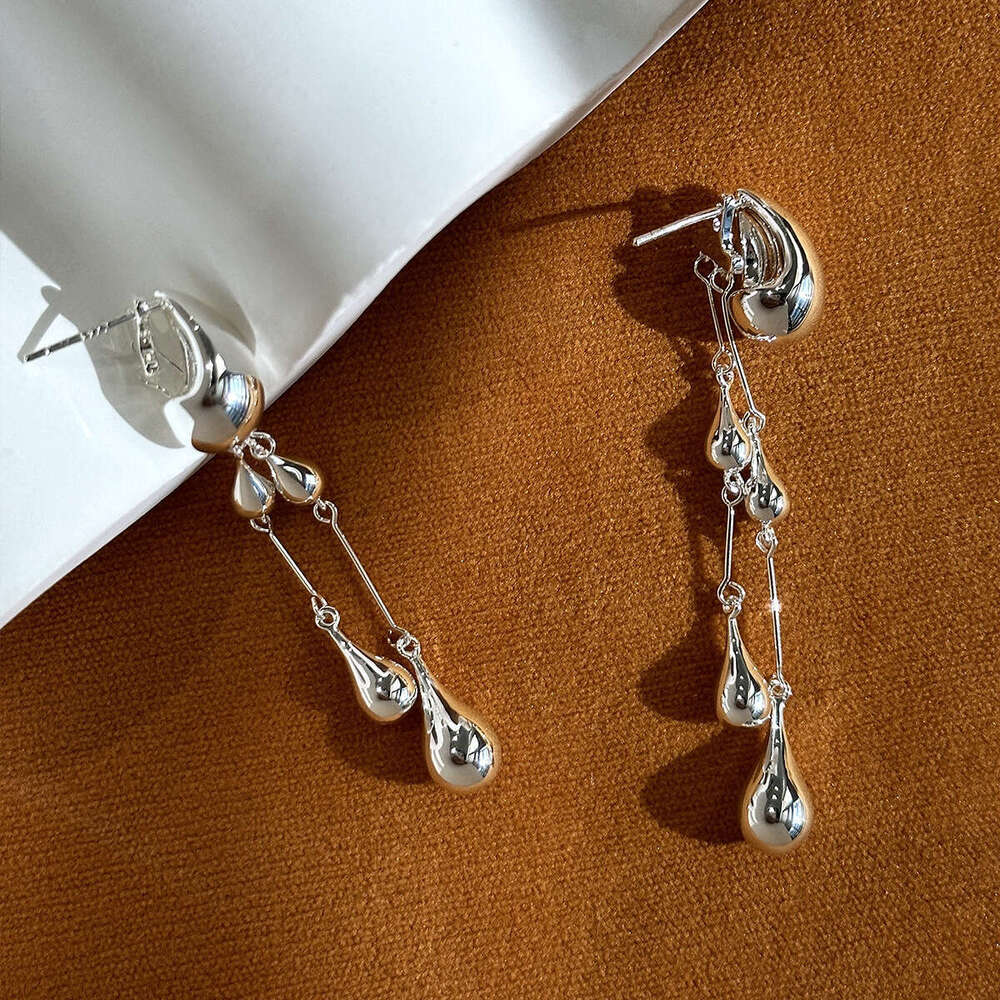 Small niche front and rear double wearing long 2024 new high-end water droplet fringe design earrings