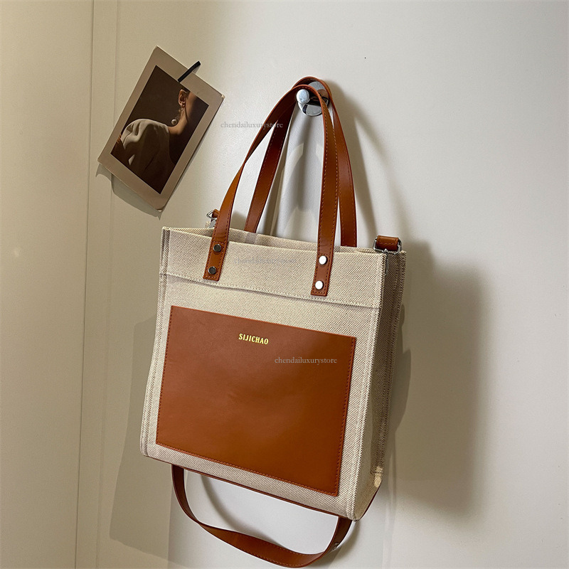 2025 Designer Bag Women's Large Capacity Comparison Canvas Upright Handbag New Letter Imprinted Commuter Shoulder Crossbody Bag Student Shopping 