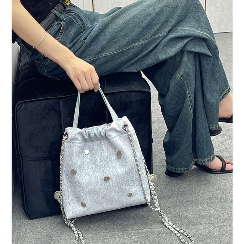 Small backpack with niche design, denim leather chain women's 2025 Korean version, casual backpack, hand-held, single shoulder, new style, unique