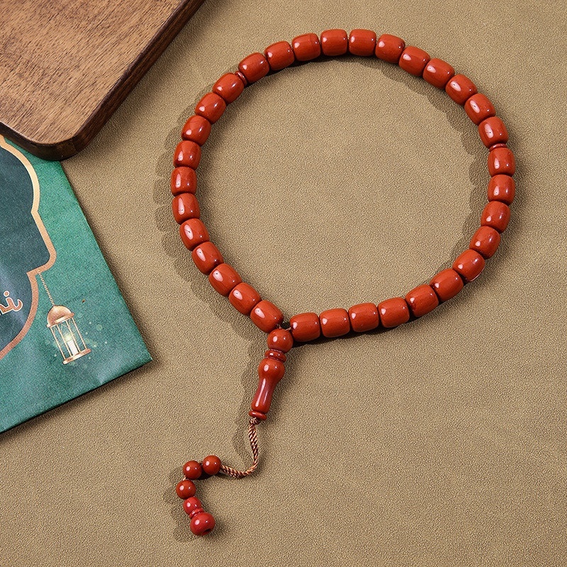 Cylindrical Buddhist with Cook holding 33 praise beads, Muslim prayer bead bracelet