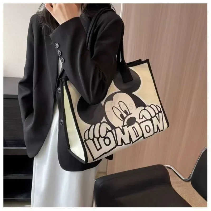 Disney New Disney Mickey Canvas Bag Womens Versatile Casual Shoulder Bag Commuter Handbag Large Capacity Multifunctional Mommy BagXJ250515