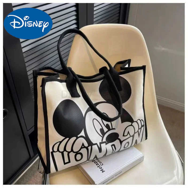 Disney New Disney Mickey Canvas Bag Womens Versatile Casual Shoulder Bag Commuter Handbag Large Capacity Multifunctional Mommy BagXJ250515