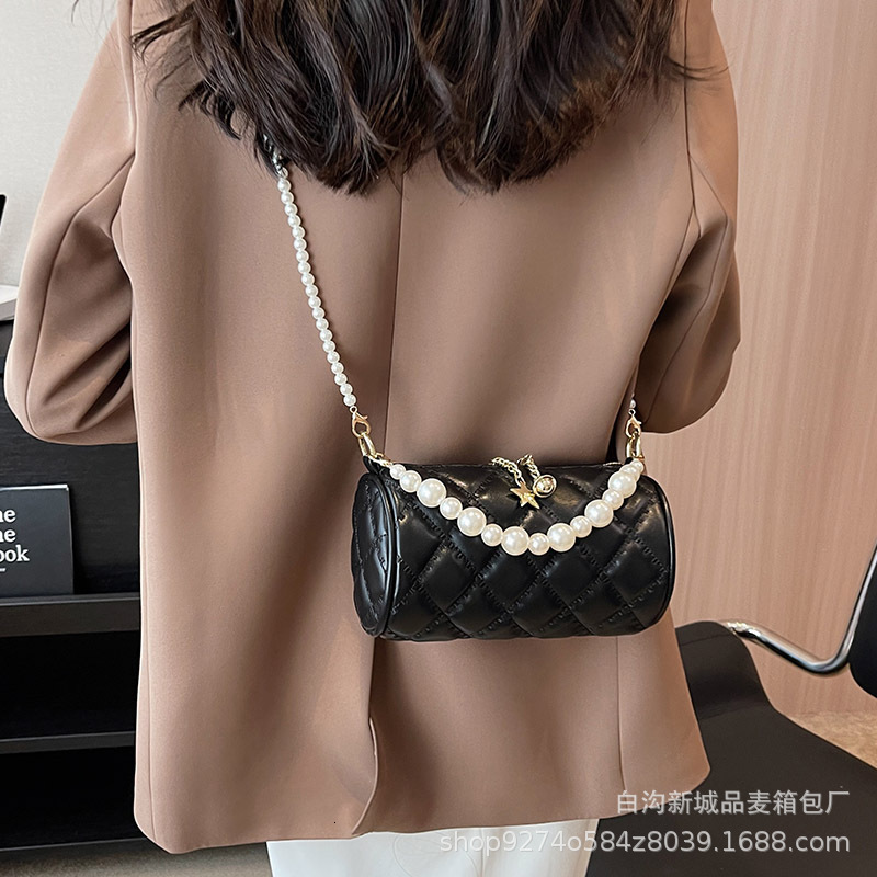 New summer single shoulder womens new pearl chain handbag simple and fashionable designer crossbody bag trendy cylindrical bag niche popular handbag c