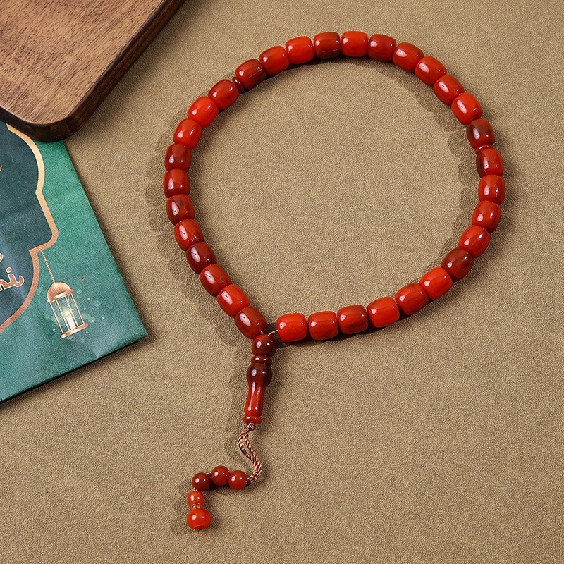 Cylindrical Buddhist with Cook holding 33 praise beads, Muslim prayer bead bracelet