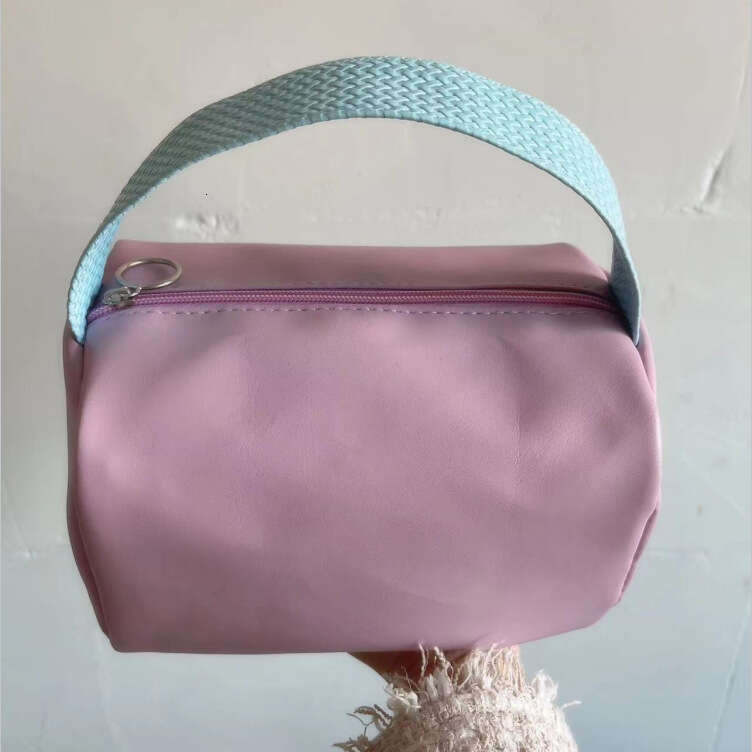 Candy colored bag with high-end storage, large capacity handheld PU waterproof makeup bag, high beauty women's handbag