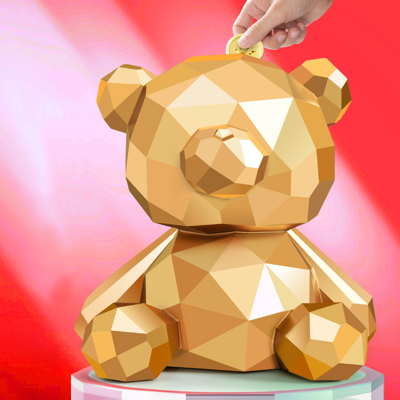 Golden sitting geometric bear money box
