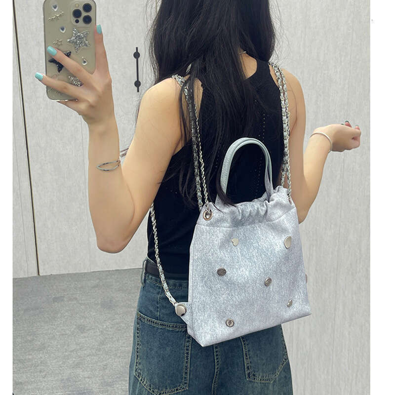 Small backpack with niche design, denim leather chain women's 2025 Korean version, casual backpack, hand-held, single shoulder, new style, unique