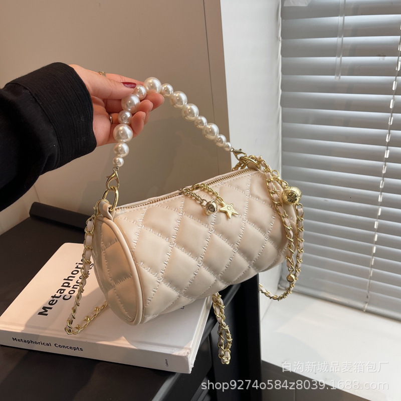 New summer single shoulder womens new pearl chain handbag simple and fashionable designer crossbody bag trendy cylindrical bag niche popular handbag c
