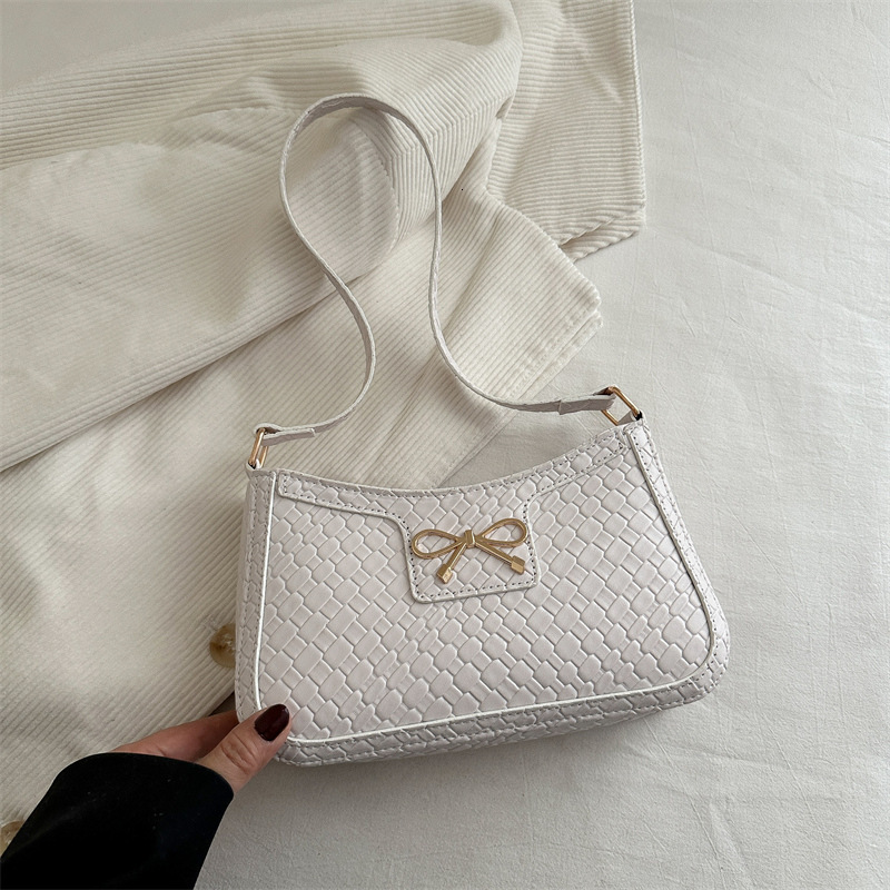 Sweet Girl Heart New Free Delivery Designer Bag Weaving Pattern 2025 Spring New Simple Fashion Western Luxury Bag Style Bow Armband Shoulder Bag Premi