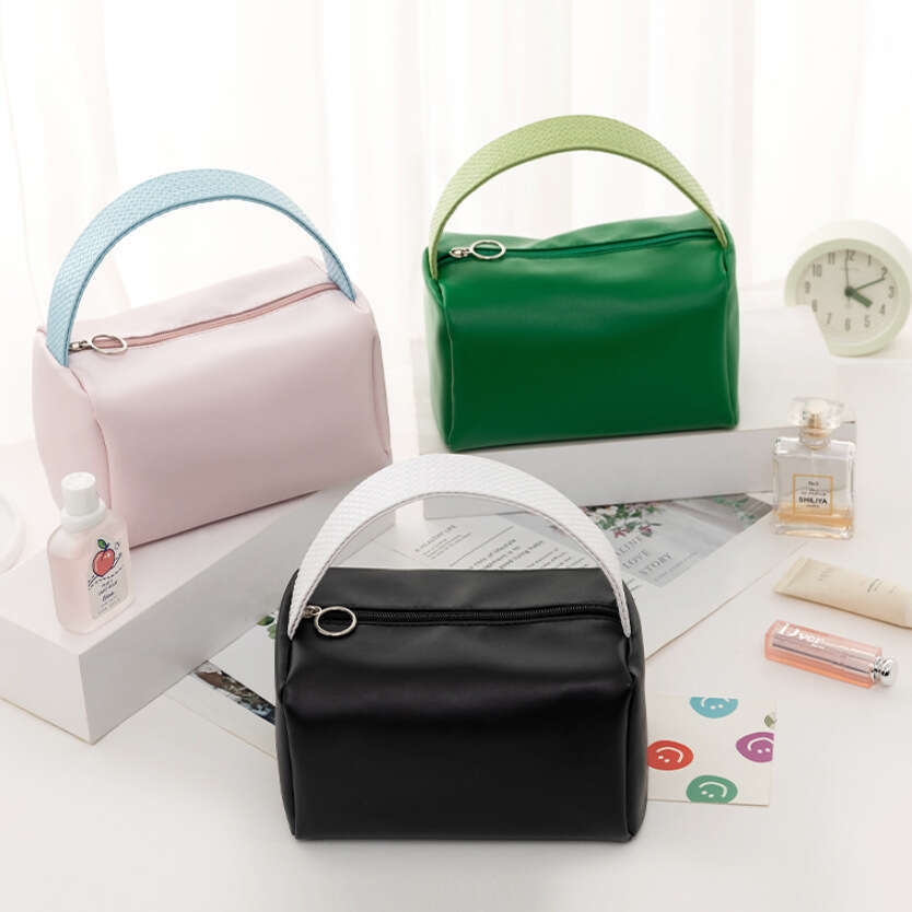Candy colored bag with high-end storage, large capacity handheld PU waterproof makeup bag, high beauty women's handbag