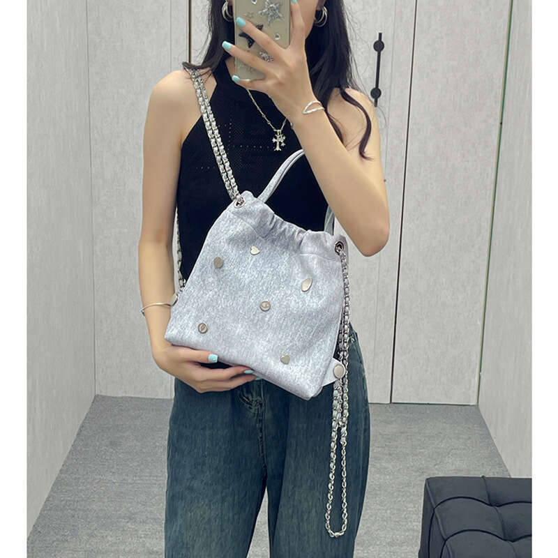 Small backpack with niche design, denim leather chain women's 2025 Korean version, casual backpack, hand-held, single shoulder, new style, unique
