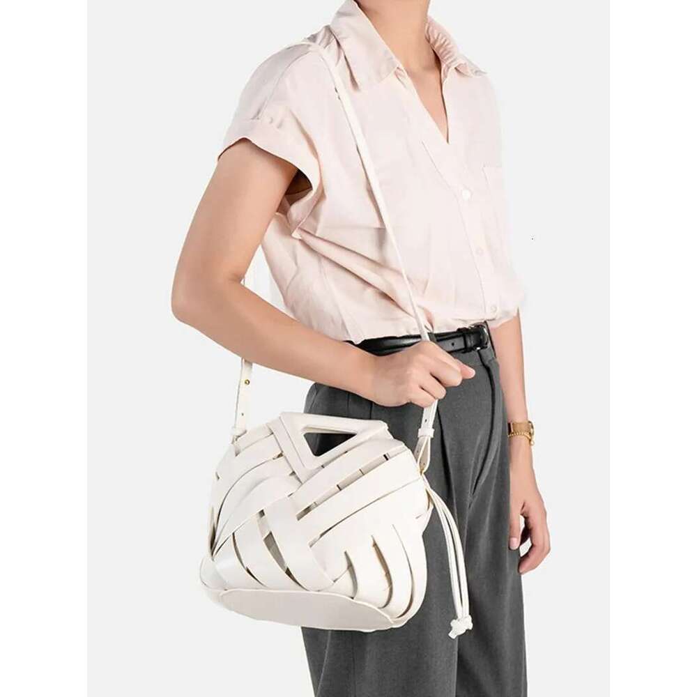 New Design Fashion Woven Genuine Leather Handbag French Portable Retro Trend Shoulder Hollow Out Bucket Bag