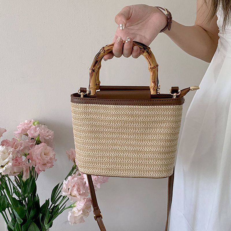 New bag for summer 2025, niche slanted designer, women's premium retro texture, hand-held straw bucket bag, women's armpit bag