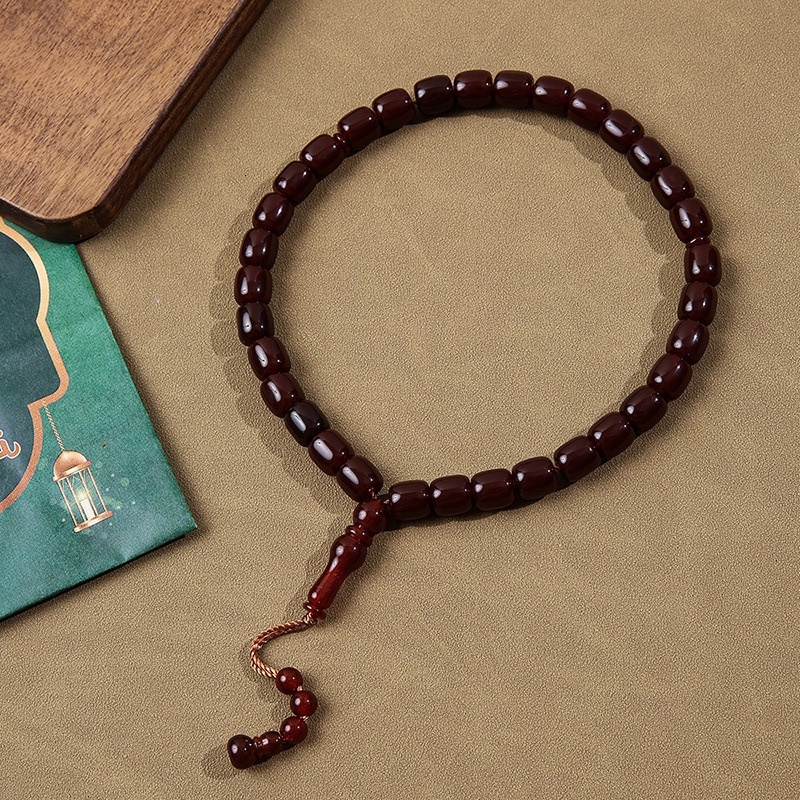 Cylindrical Buddhist with Cook holding 33 praise beads, Muslim prayer bead bracelet