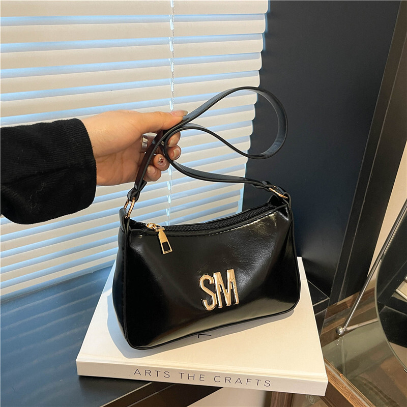 Western Women's 2025 Luxury Bag Summer New Style Texture Popular Letter Commuting Handheld New Free Delivery Designer Bag Crossbody Bag Trend