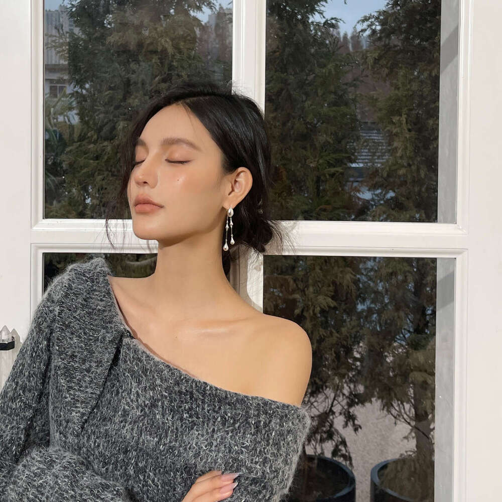 Small niche front and rear double wearing long 2024 new high-end water droplet fringe design earrings