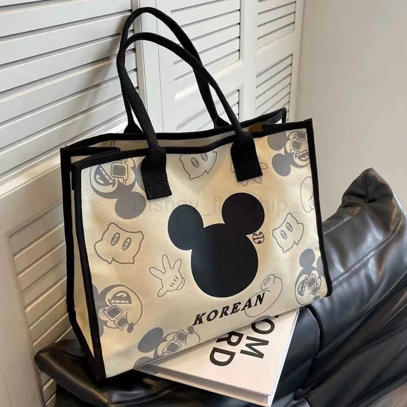 Disney 2024 New Mickey and Minnie Canvas Shoulder Bag Commuter Fashion Tote Bag Large Capacity Handbag Mommy BagXJ250515