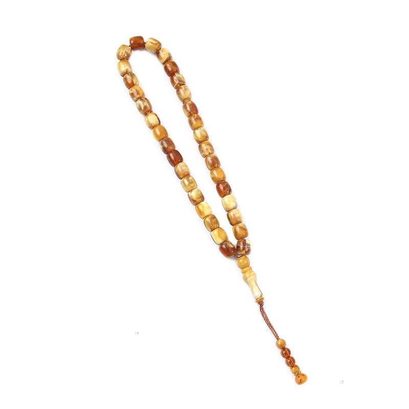 Cylindrical Buddhist with Cook holding 33 praise beads, Muslim prayer bead bracelet