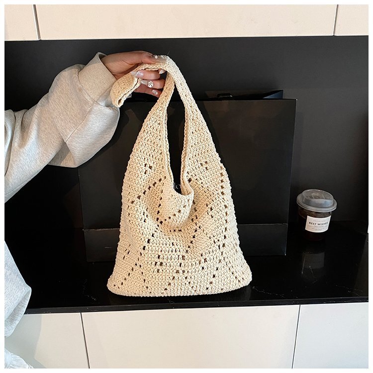 New French style artistic hollow weaving large capacity tote bag crochet shoulder bag fairy vacation handheld beach bag lazy and simple designer shoul