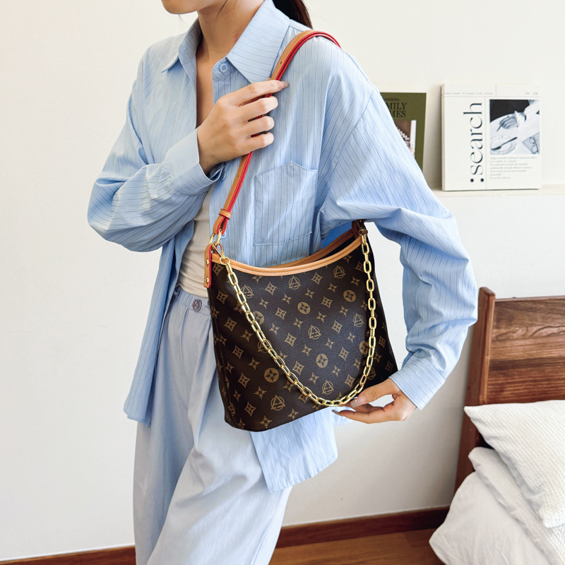 Free shipping 2025 new designer bag fashionable commuting large capacity bucket bag premium texture printed single shoulder diagonal cross bag for wom