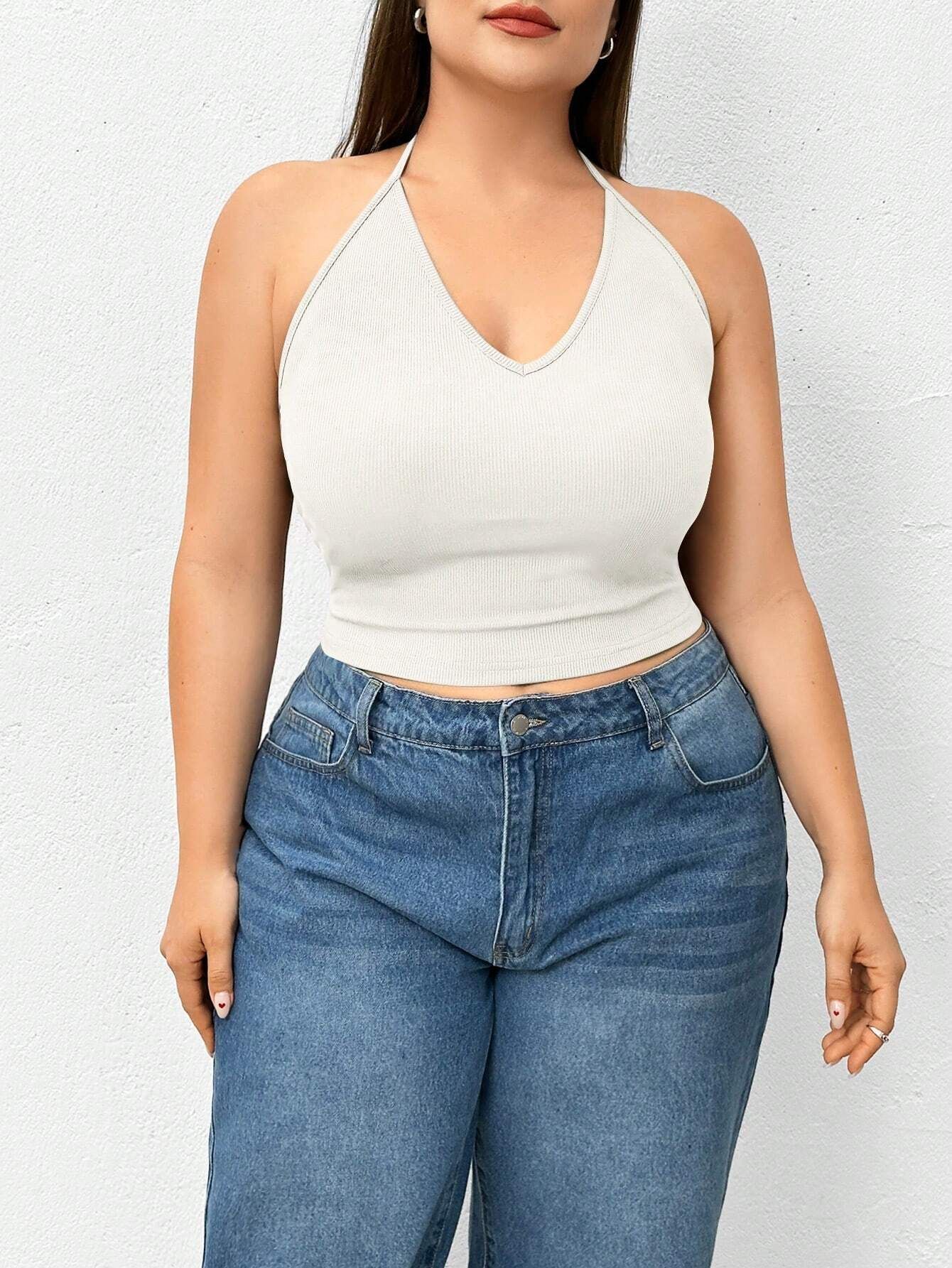 Oversized Womens Clothing with a Base Layer a Hanging Neck Camisole a Tank Top and a Spicy Knit Top Worn Outside