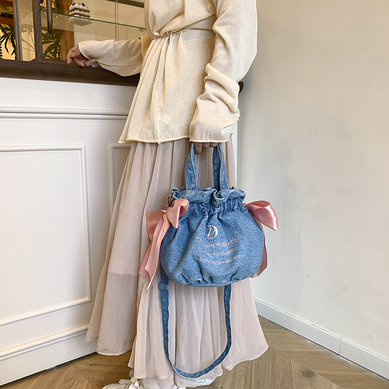 2025S designer bag new light luxury and high-end sense single shoulder crossbody large capacity drawstring denim cloth bag hand-held canvas handbag
