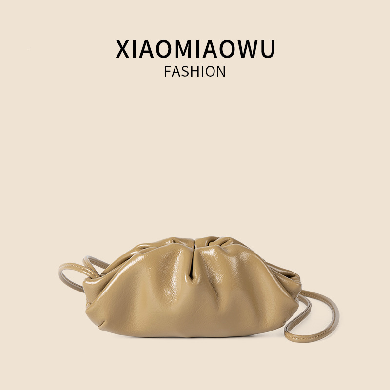 2025S designer new women oil wax leather hanging neck niche simple and melodious shoulder Korean commuting wrinkled mini dumpling bag