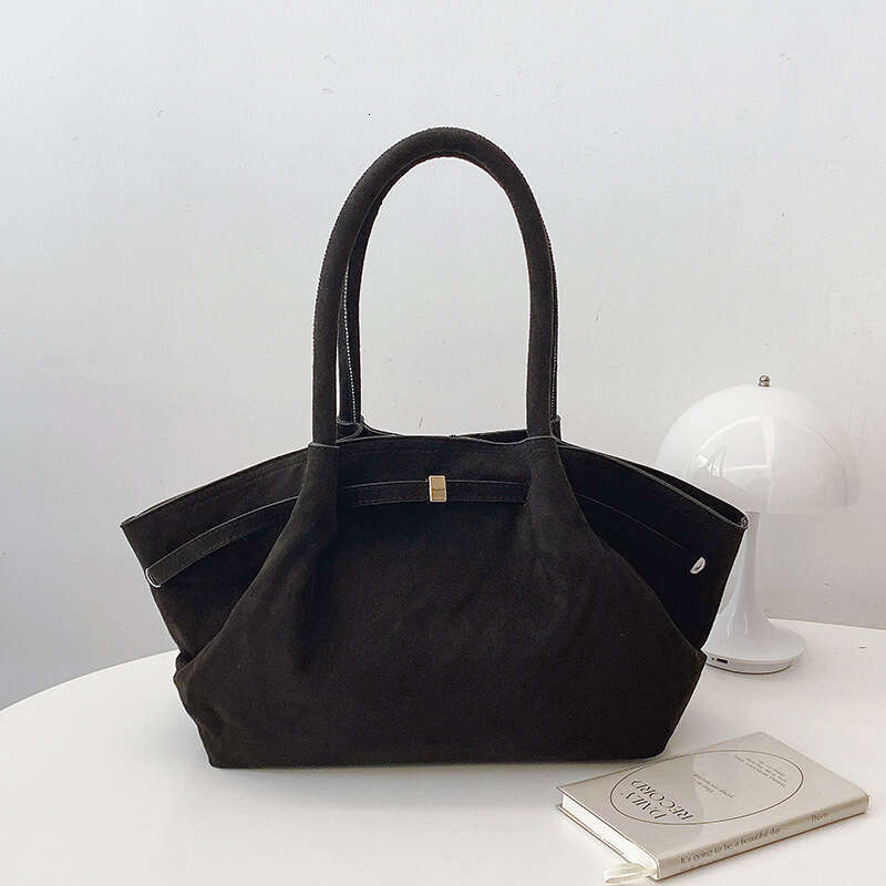 Design sense, large capacity, niche, high aesthetic handheld tote for women suede pleated underarm dumpling bag 2025 new style, unique and elegant tem
