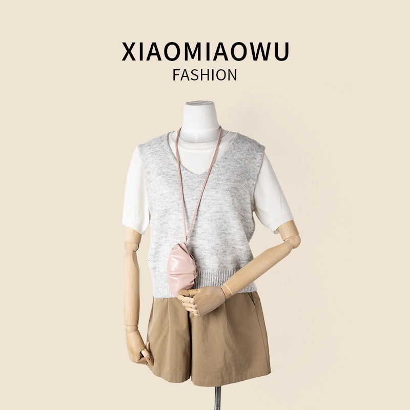 2025S designer new women oil wax leather hanging neck niche simple and melodious shoulder Korean commuting wrinkled mini dumpling bag