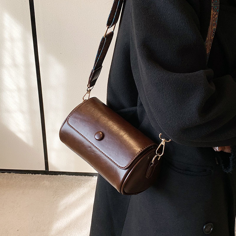 New bag with slanted body for women niche spring and summer fashion designer multifunctional cylindrical bag retro high-end solid color single shoulde
