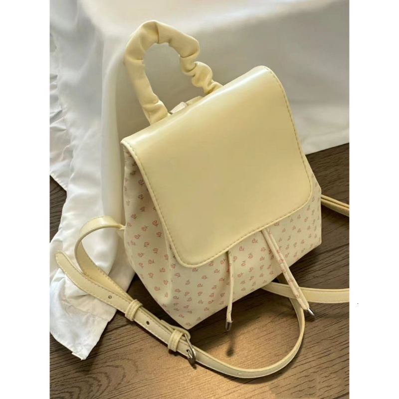 2025S designer cute pleated floral polka dot universal women bag trendy shopping and elegant small backpack casual outdoor commuting bag