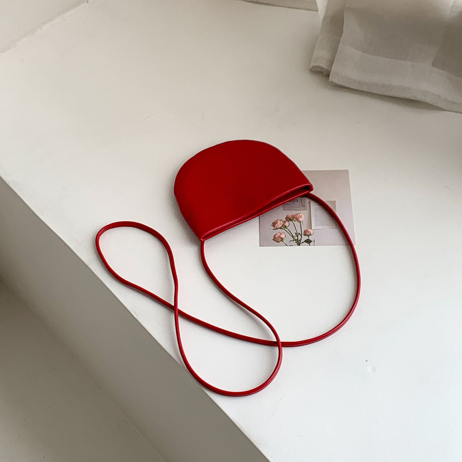 2025S designer summer new simple hanging neck Korean trendy small women crossbody versatile semi-circular mini bag