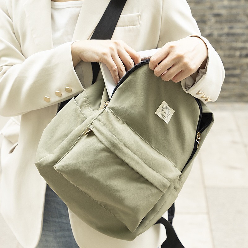 2025S designer bag with high aesthetic value solid color Instagram style backpack student girl travel trend lightweight small backpack