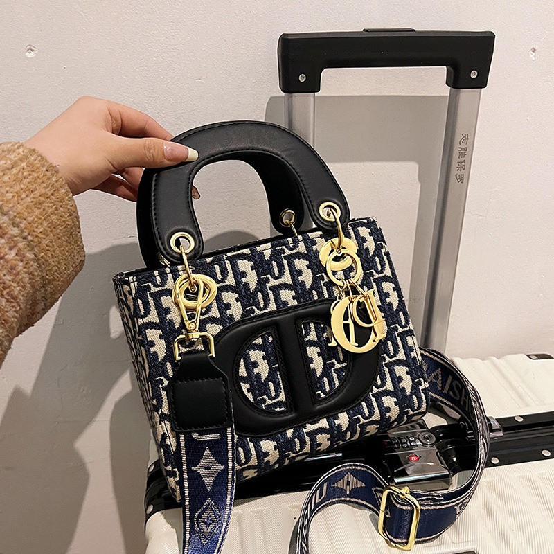 The new women's handbag is simple and fashionable, with a large capacity and exquisite embroidery. It is a portable handbag for women and a cross