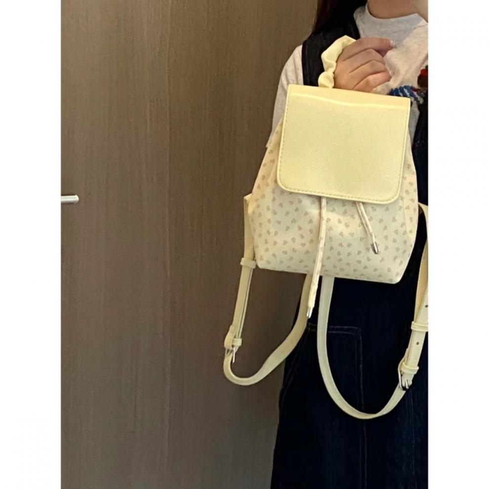 2025S designer cute pleated floral polka dot universal women bag trendy shopping and elegant small backpack casual outdoor commuting bag
