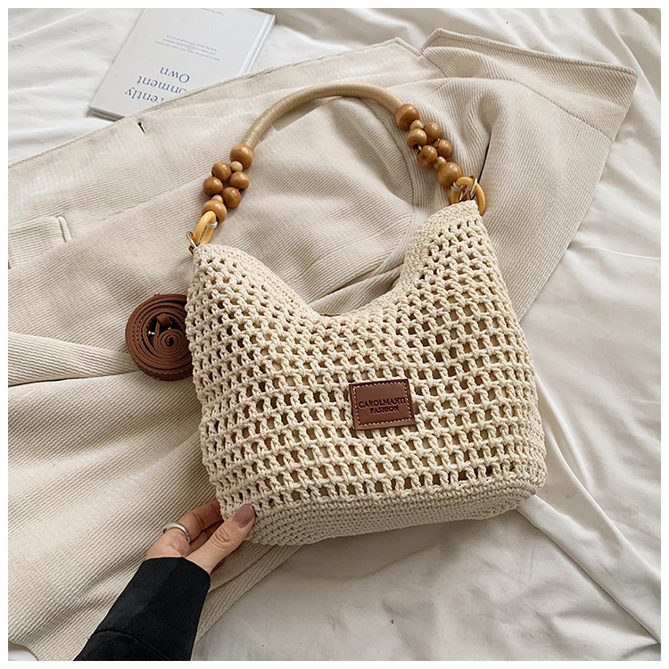 2025S designer beach vacation woven women new hollowed out knitted handbag large capacity shoulder bag armpit bag