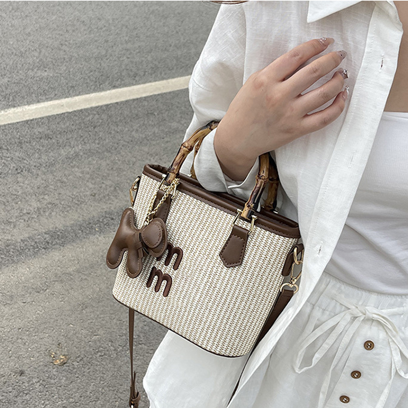 Free shipping 2025 designer bag new spring basket bag fashion contrast straw woven bag bamboo vegetable Bucket Bag Handbag single shoulder bag straddl