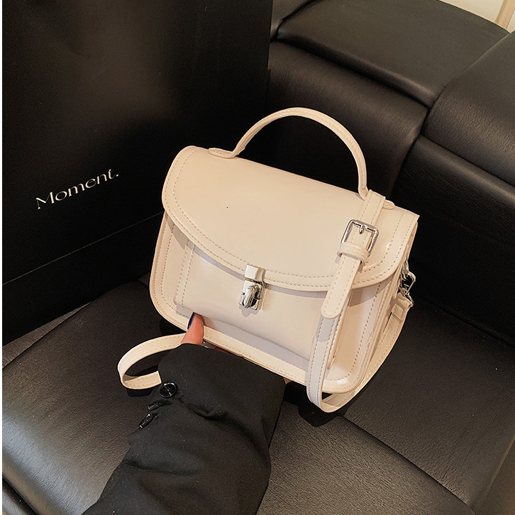 2025 Women's Lock Shoulder Cross Bag Free Shipping Designer Korean Edition Multi Functional Postman Handheld Small Square Bag Simple Leisure Comm