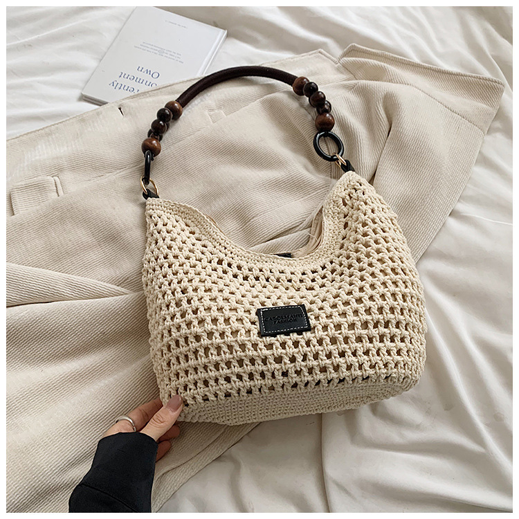 2025S designer beach vacation woven women new hollowed out knitted handbag large capacity shoulder bag armpit bag