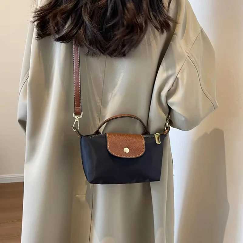 2025 Womens Mini Garbage Handbag High end Nylon Fabric Fashion Shoulder/Cross shaped Mobile Phone Bag M250516