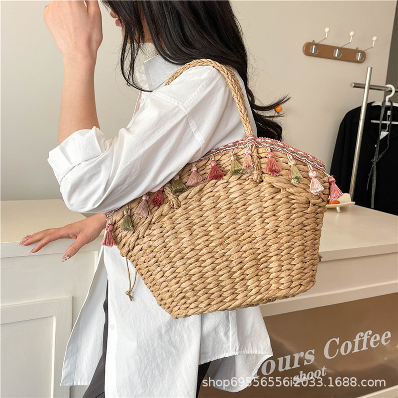 2025S Designer Straw Women New Fashionable and Versatile Large Capacity Bucket Beach Woven Handheld Vegetable Basket Bag