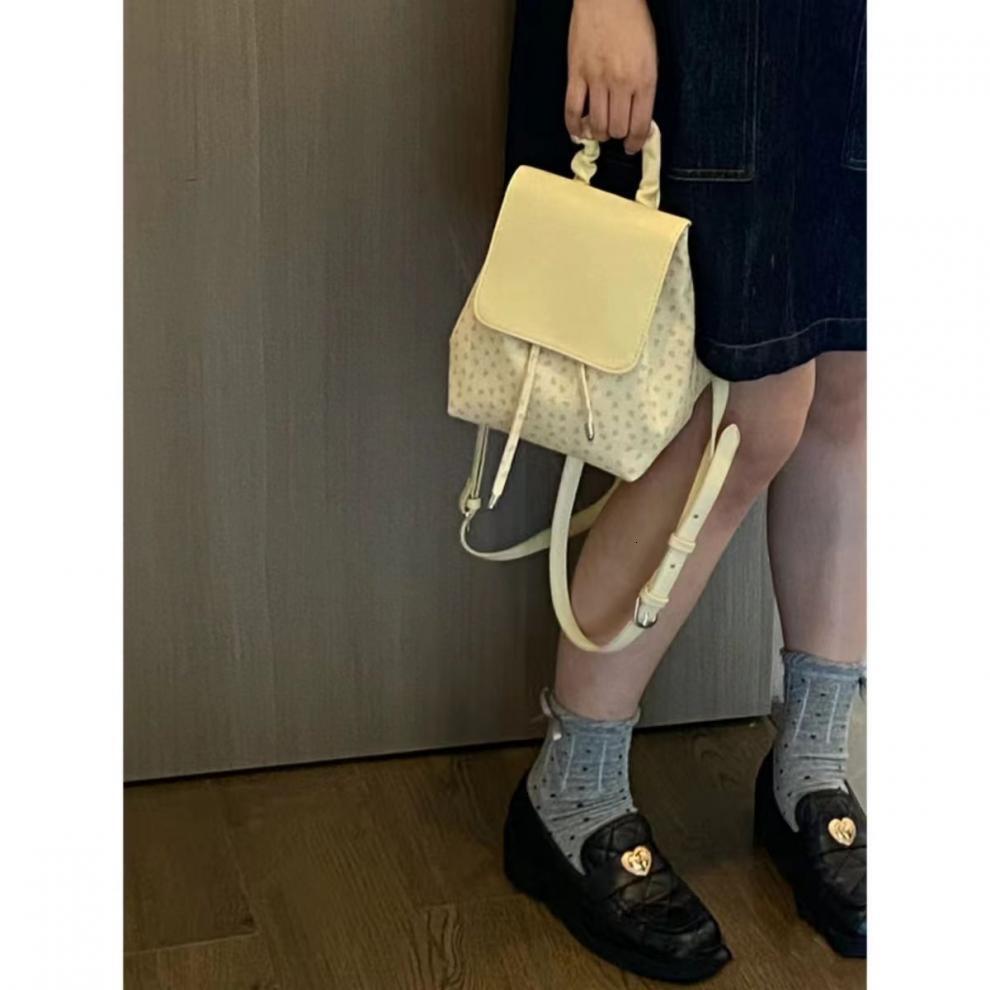 2025S designer cute pleated floral polka dot universal women bag trendy shopping and elegant small backpack casual outdoor commuting bag