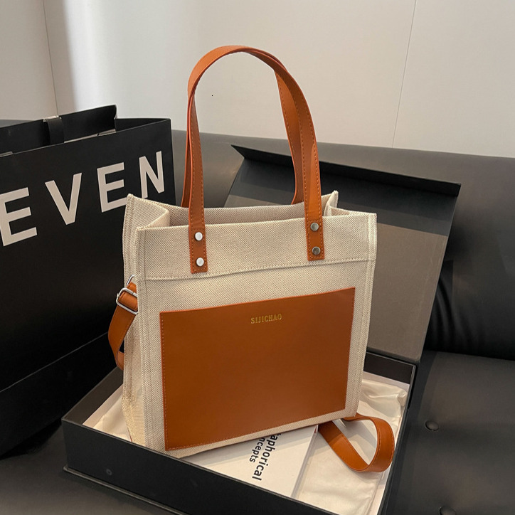2025 Designer Bag Women's Large Capacity Comparison Canvas Upright Handbag New Letter Imprinted Commuter Shoulder Crossbody Bag Student Shopping 